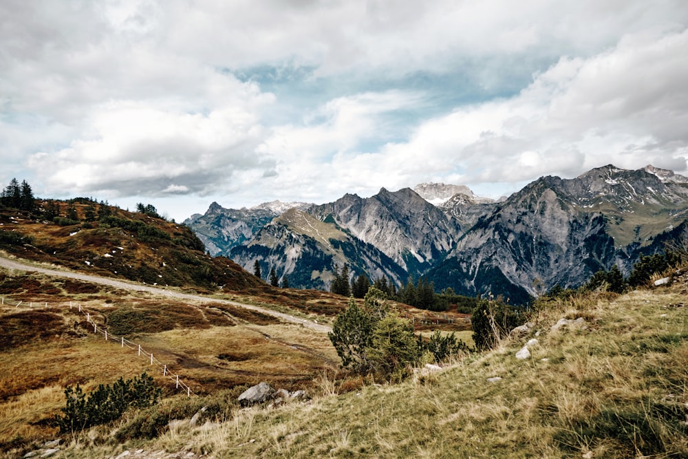 a view of a mountain range with a cloudy sky