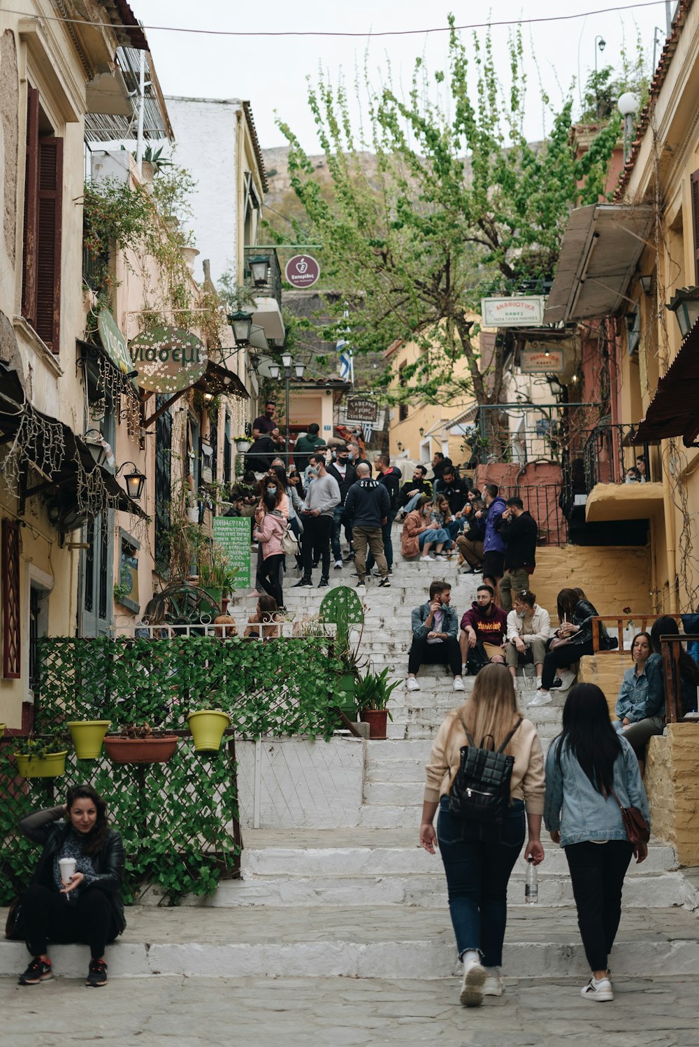 a group of people walking on a city street