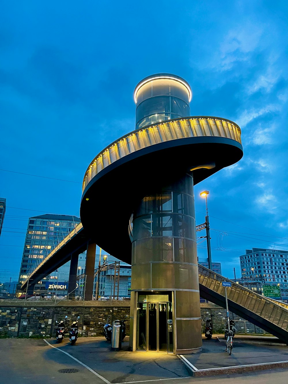 a tall building with a spiral staircase going up it's side