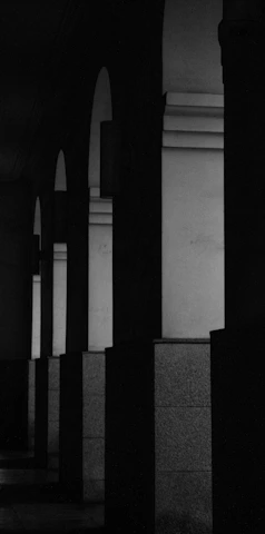 a black and white photo of a person on a skateboard
