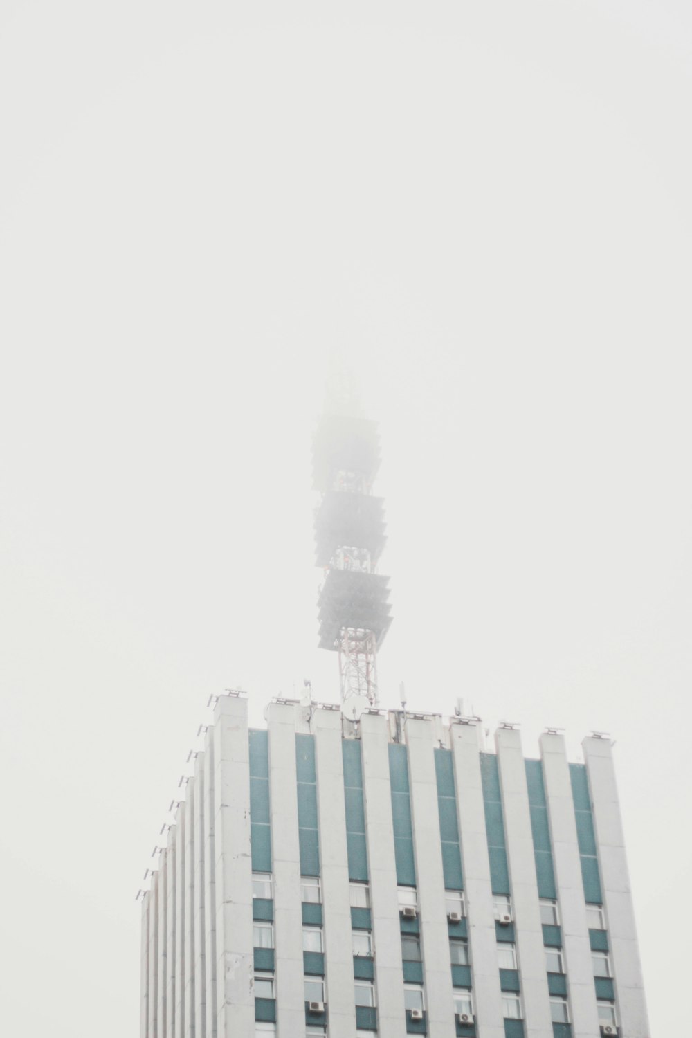 a tall white building with a tower on top