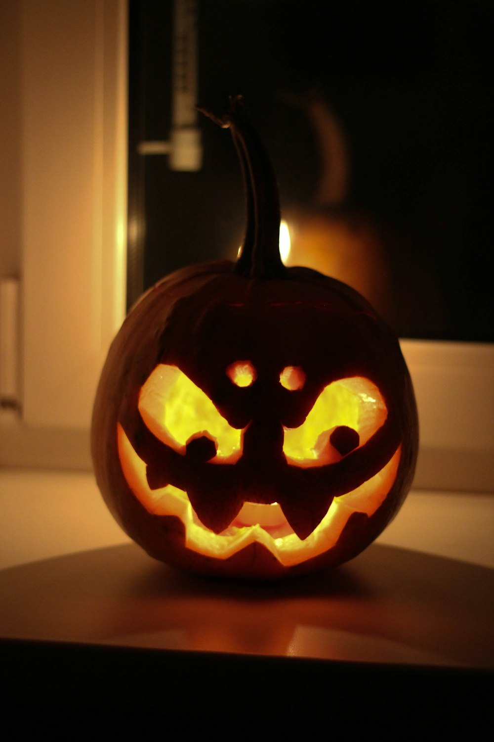 a carved pumpkin sitting on top of a table