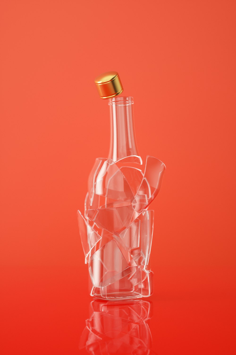 a glass bottle with a gold cap on a red background