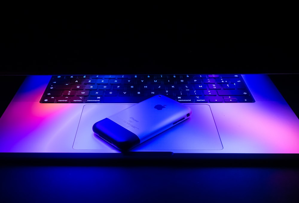 a laptop computer with a lit up keyboard