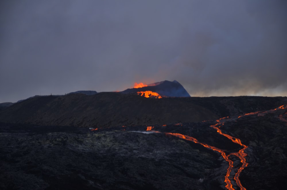 a mountain with a fire burning in the distance