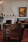 Interior shot of a cozy fireplace corner with traditional Himachali decor.