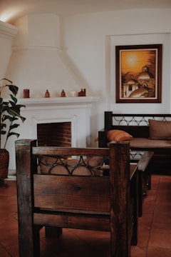 A cozy living room scene featuring a glowing temple replica on a mantelpiece.
