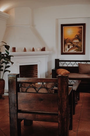 A cozy living room featuring a decorative fire vase glowing softly on a wooden table.