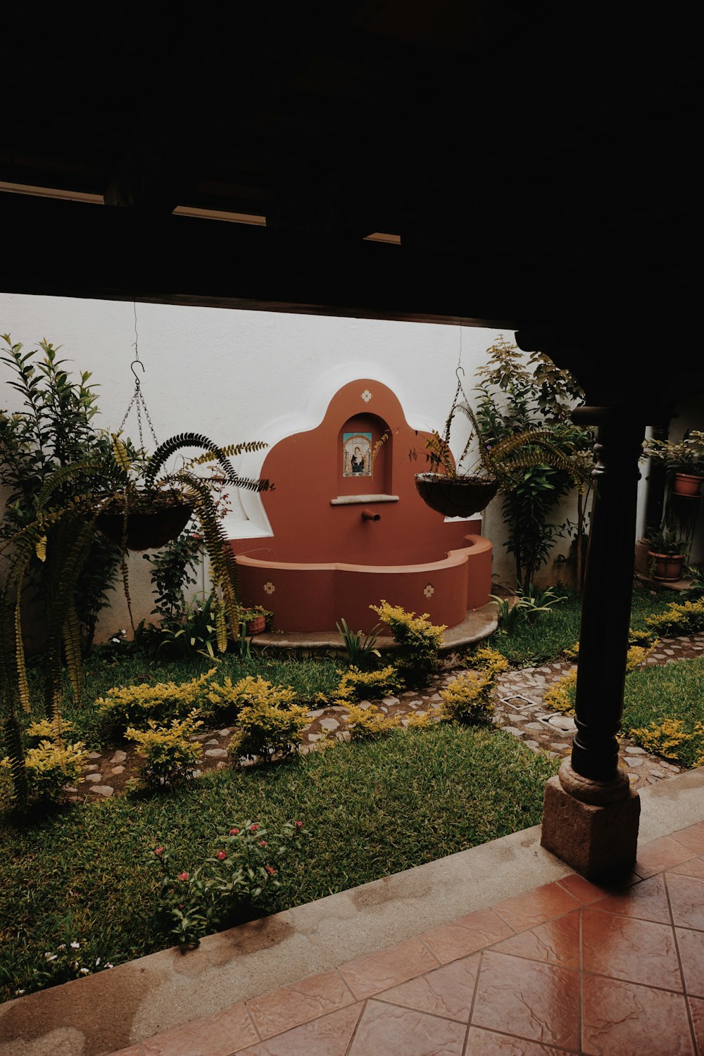 a red building with a clock on the side of it