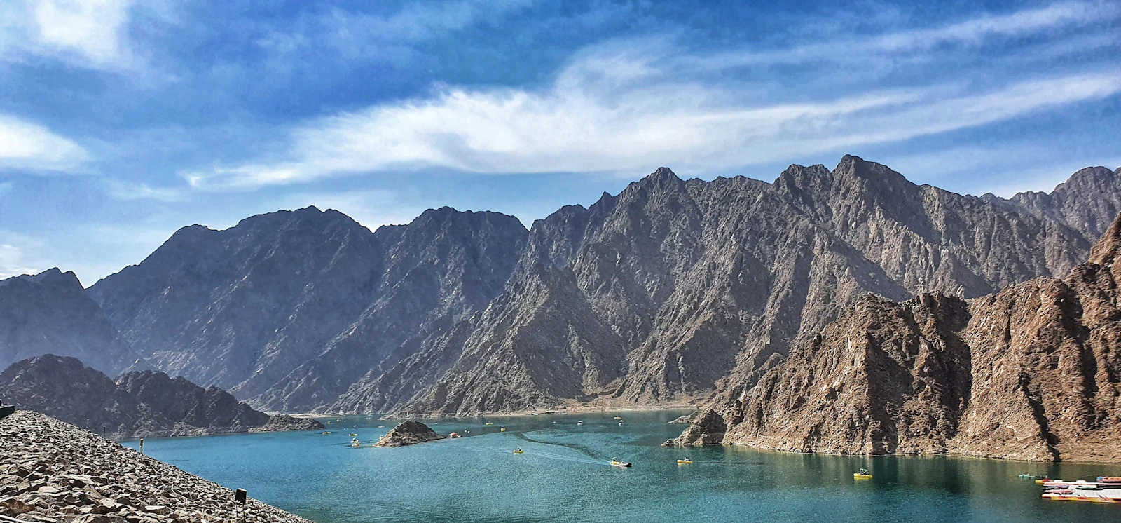 Hatta Dam surrounded by steep rocky mountains