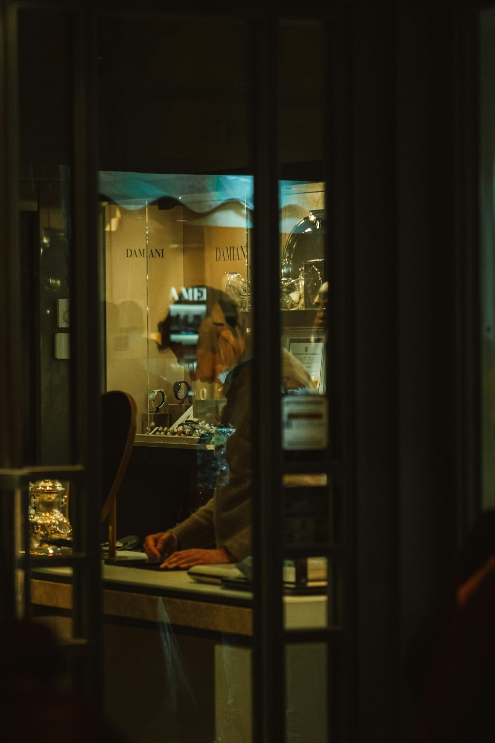 a man sitting at a counter in a restaurant