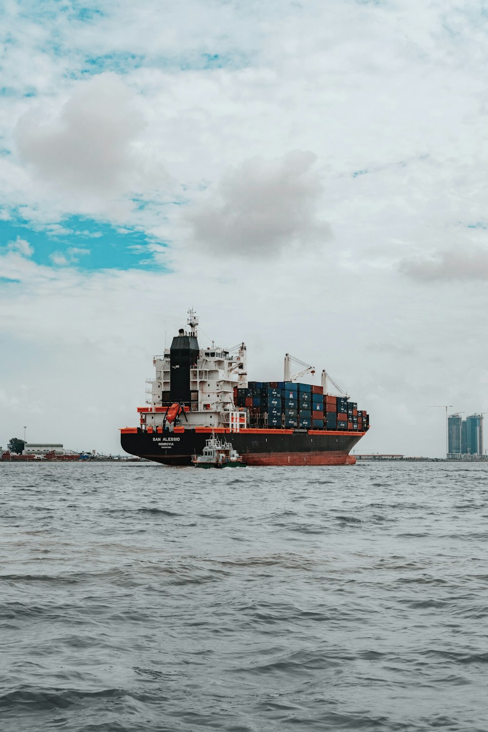 a large cargo ship in the middle of the ocean