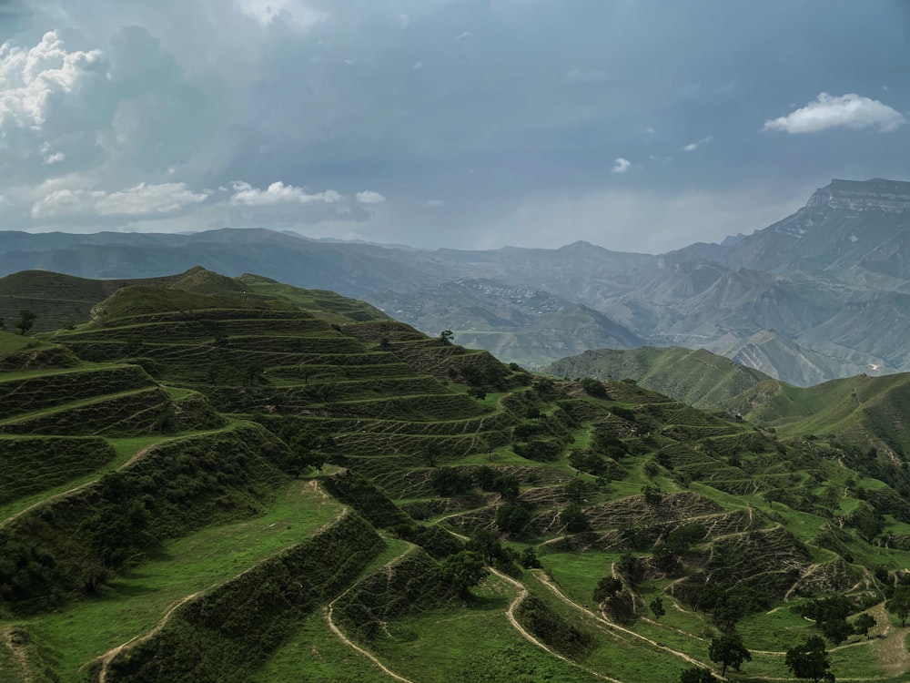 a view of a mountain range with a cloudy sky