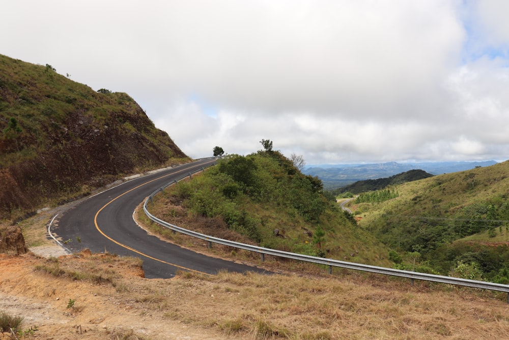 a curved road on the side of a hill