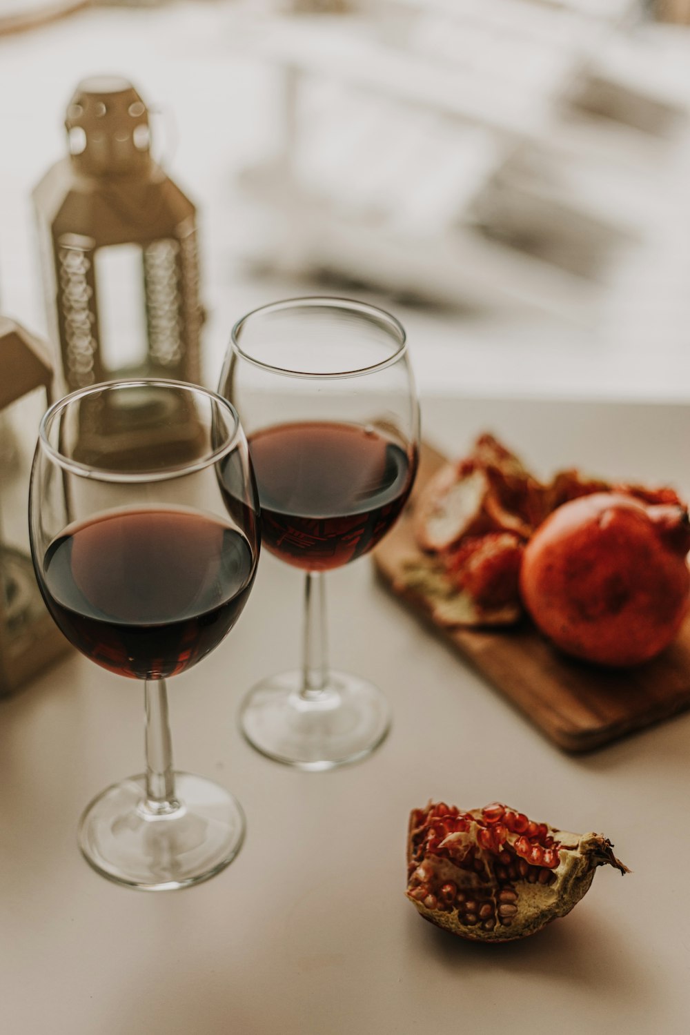 a couple of glasses of wine sitting on top of a table