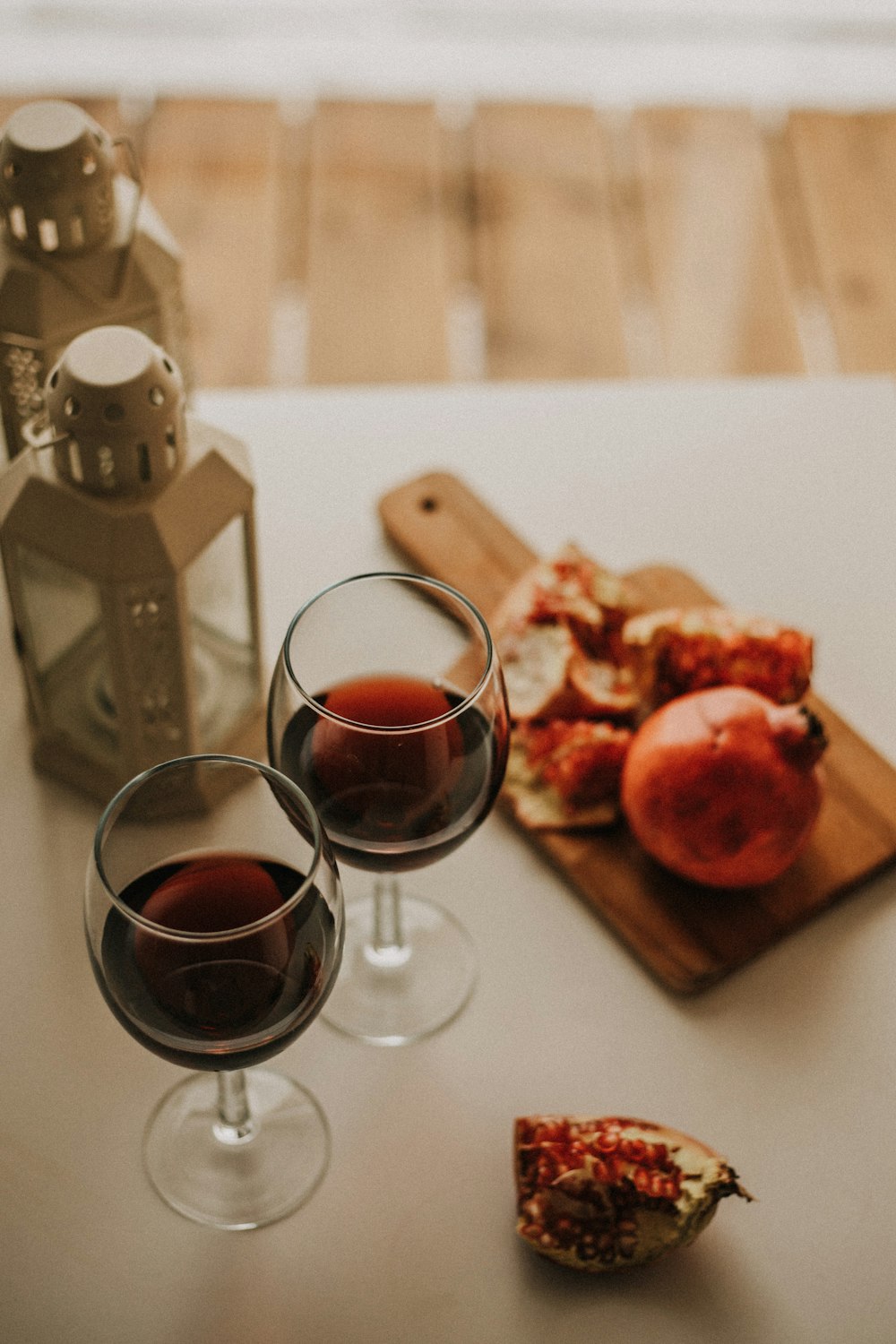 a couple of glasses of wine sitting on top of a table