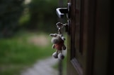 a key chain hanging from a door handle