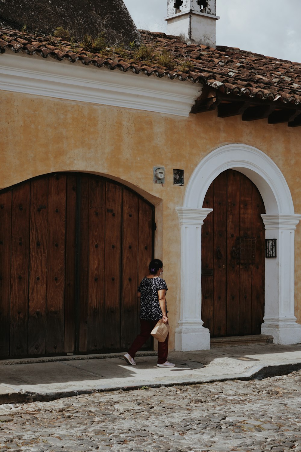 a man and a woman standing in front of a building