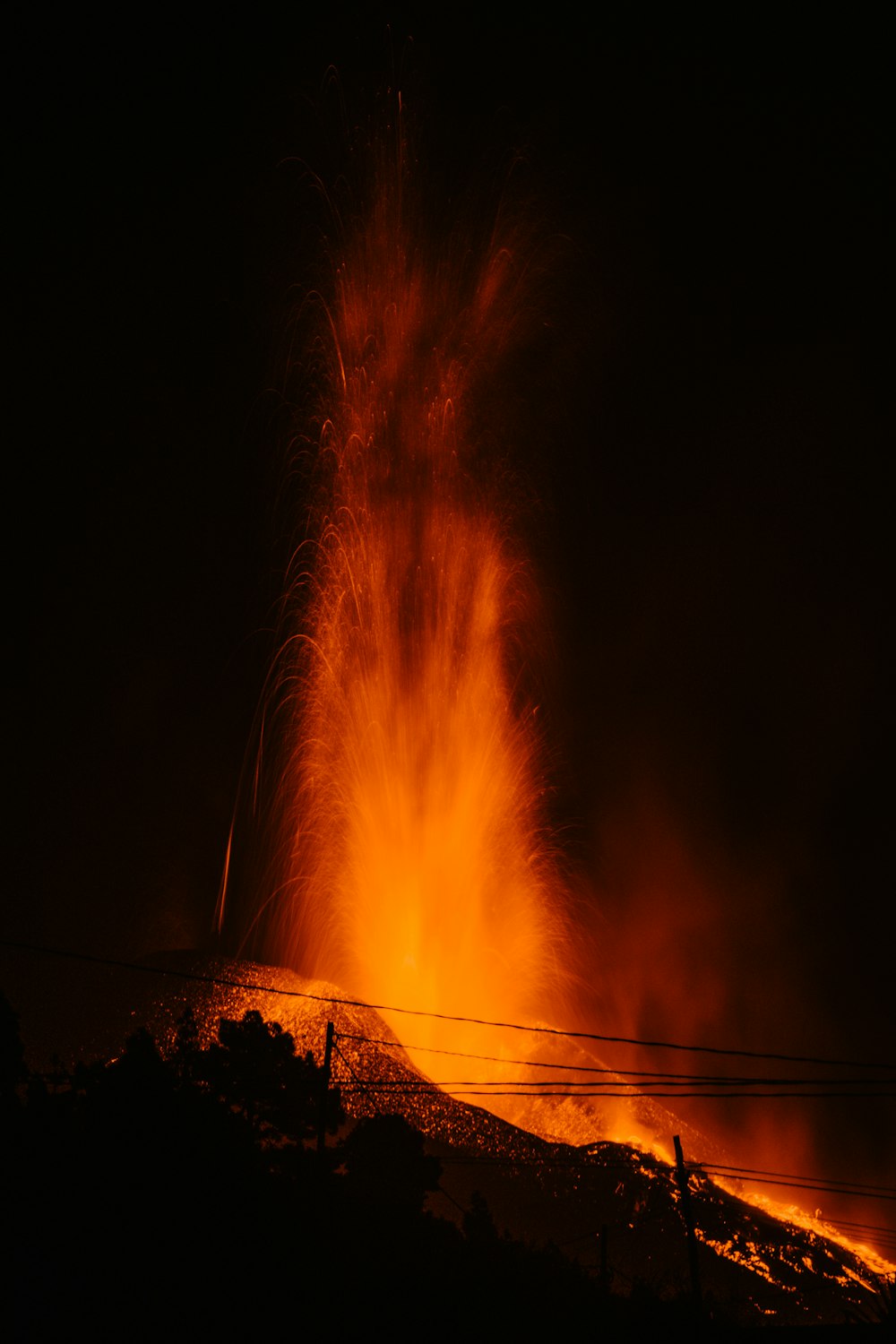 a large fire is lit up in the dark