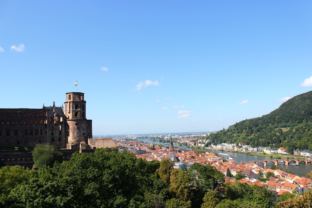 a view of a city and a river from a hill