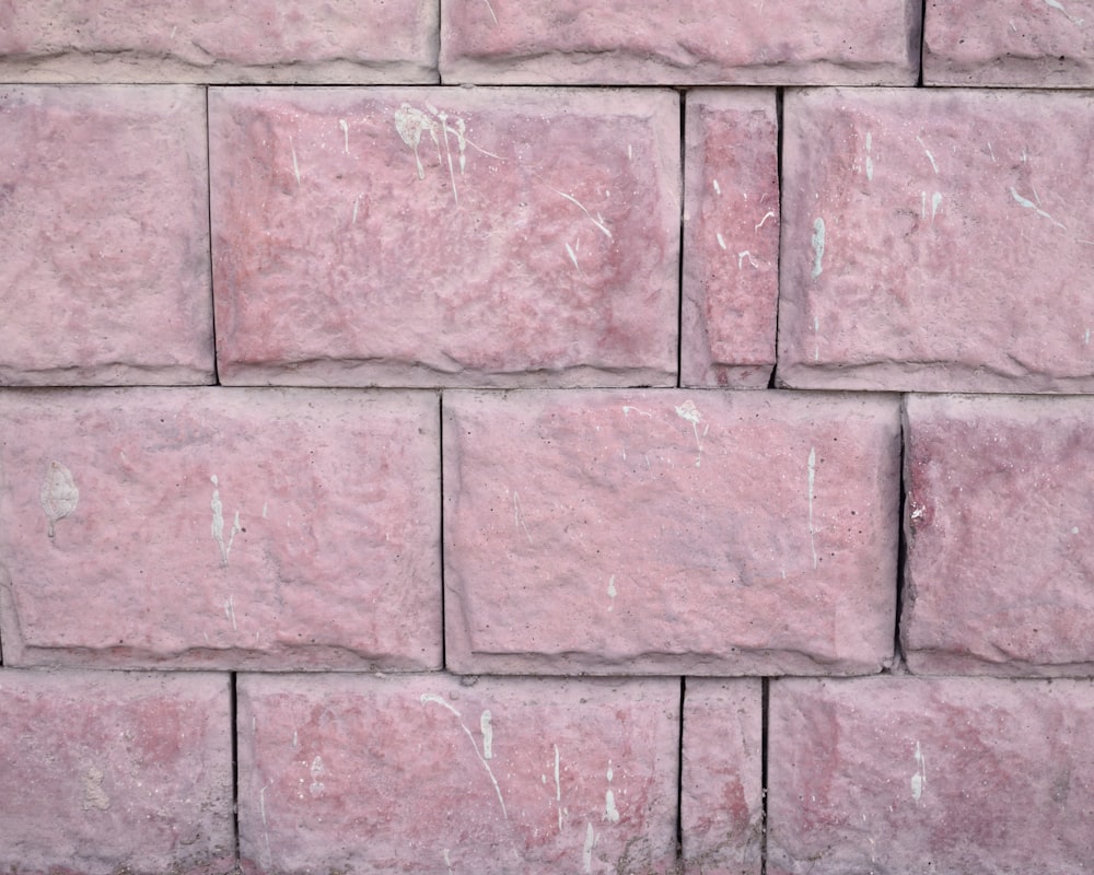 a close up of a pink brick wall