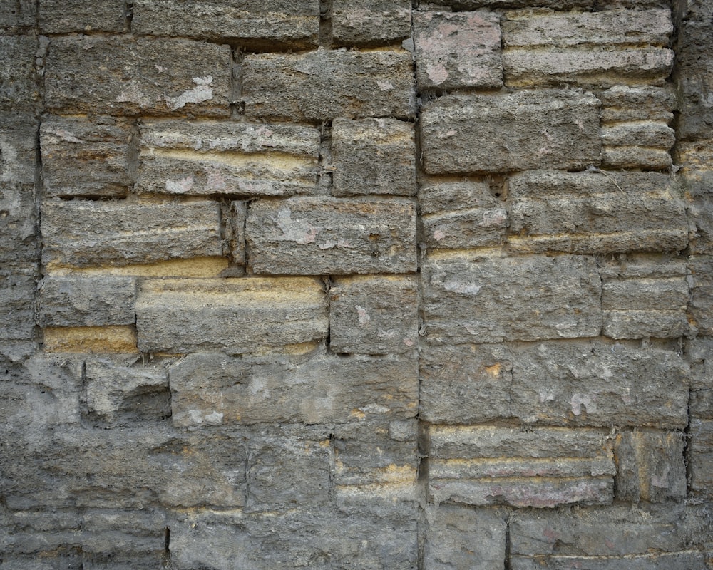 a close up of a wall made of rocks