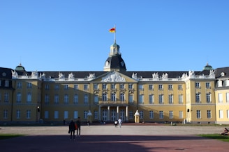a large building with a flag on top of it
