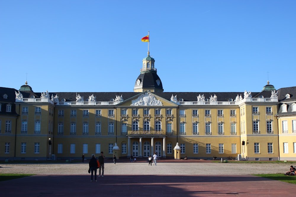 a large building with a flag on top of it