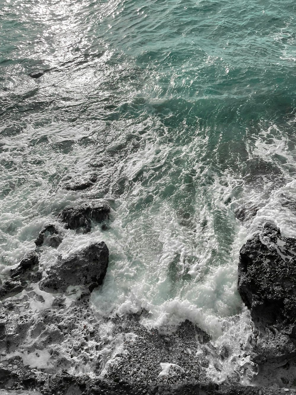 a man riding a wave on top of a body of water