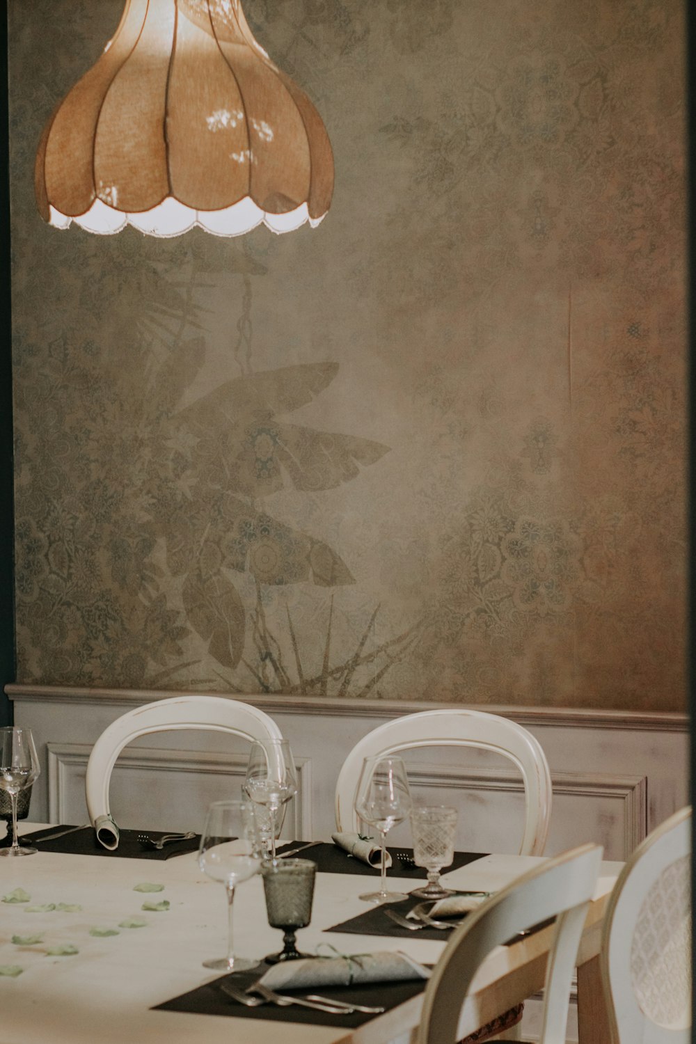 a dining room with a table and chairs