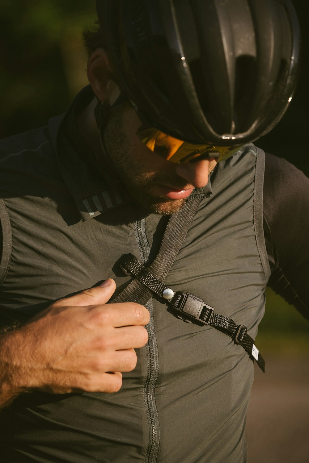 a close up of a person wearing a bike helmet