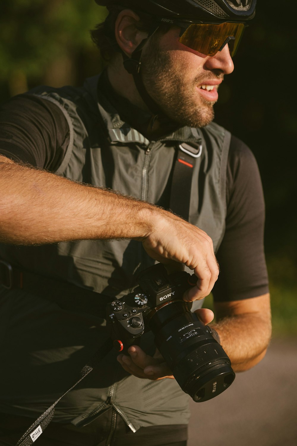 a man wearing a helmet and holding a camera