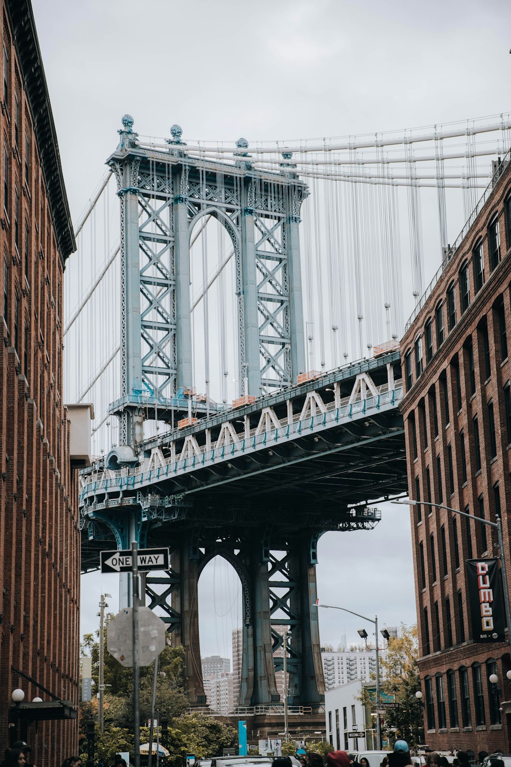 a tall bridge spanning over a city street