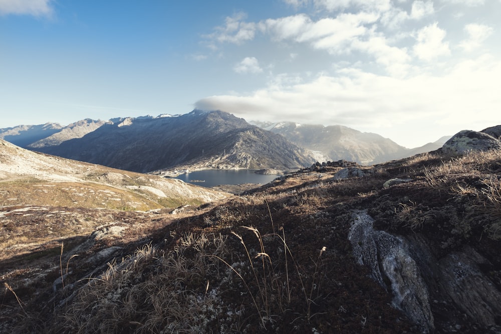 a view of a mountain range with a body of water in the distance