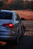 a white car parked on the side of a road
