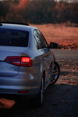 a white car parked on the side of a road