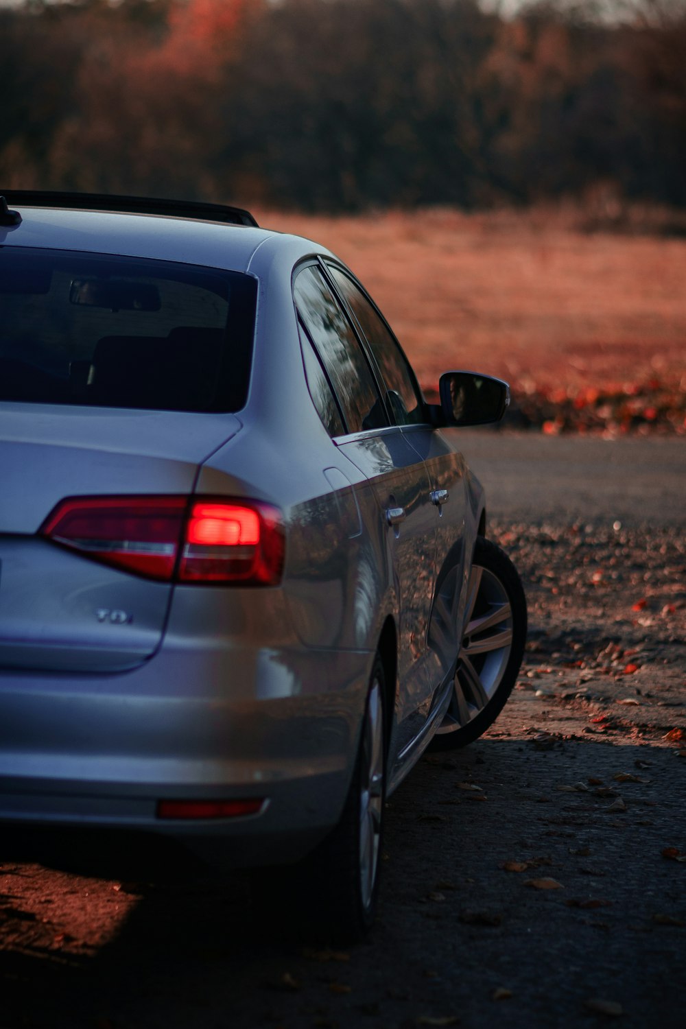 a white car parked on the side of a road