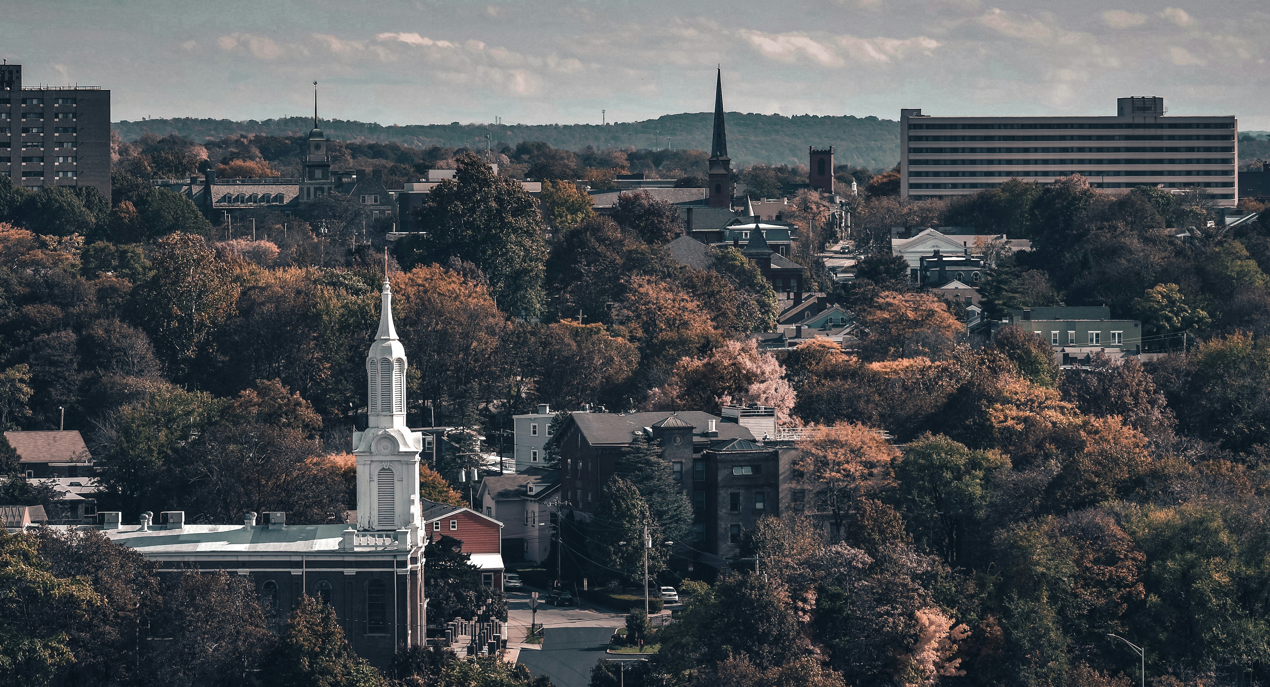 a view of a city with a church steeple
