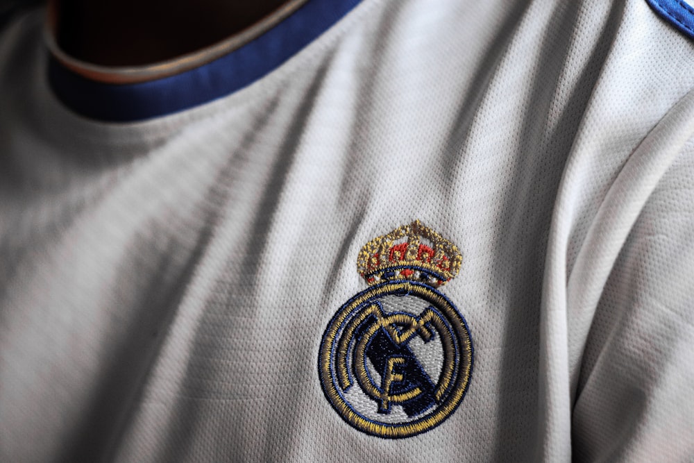 a close up of a soccer jersey with a crown on it