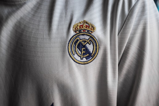 a close up of a soccer jersey with a crown on it