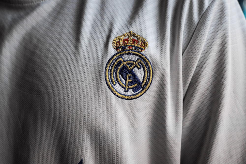 a close up of a soccer jersey with a crown on it