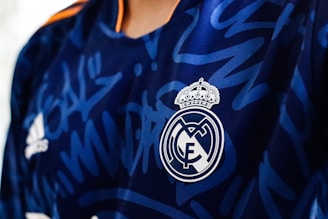 a close up of a soccer jersey with a crown on it