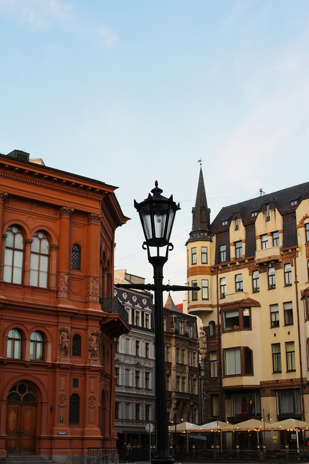 a street light in front of a row of buildings
