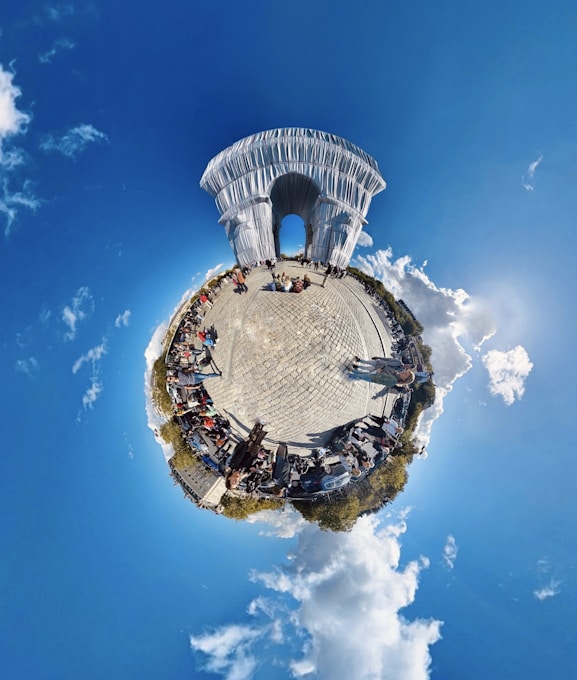 a small island in the middle of a blue sky