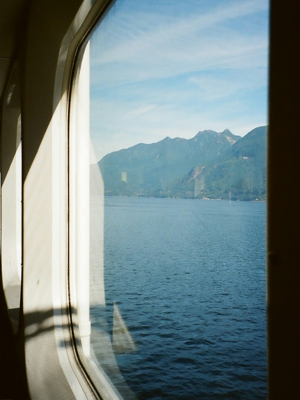 a view of a body of water from a train window