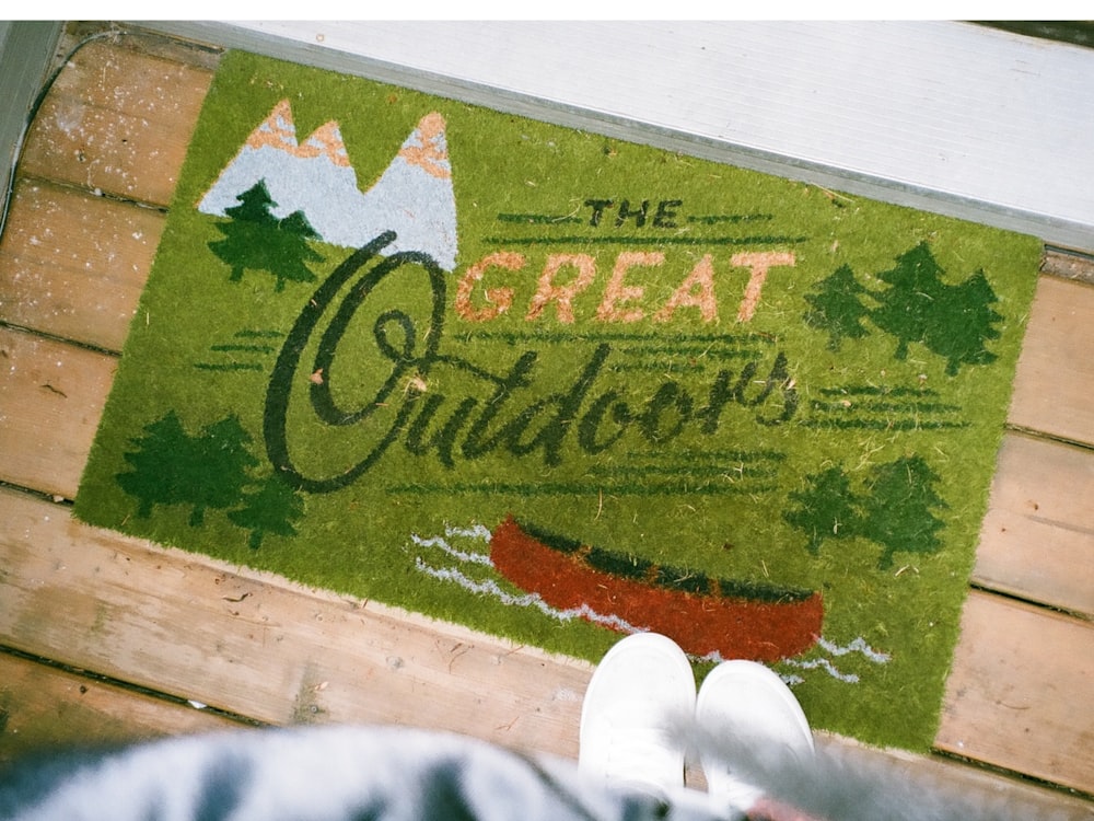 a door mat with the words the great outdoors on it