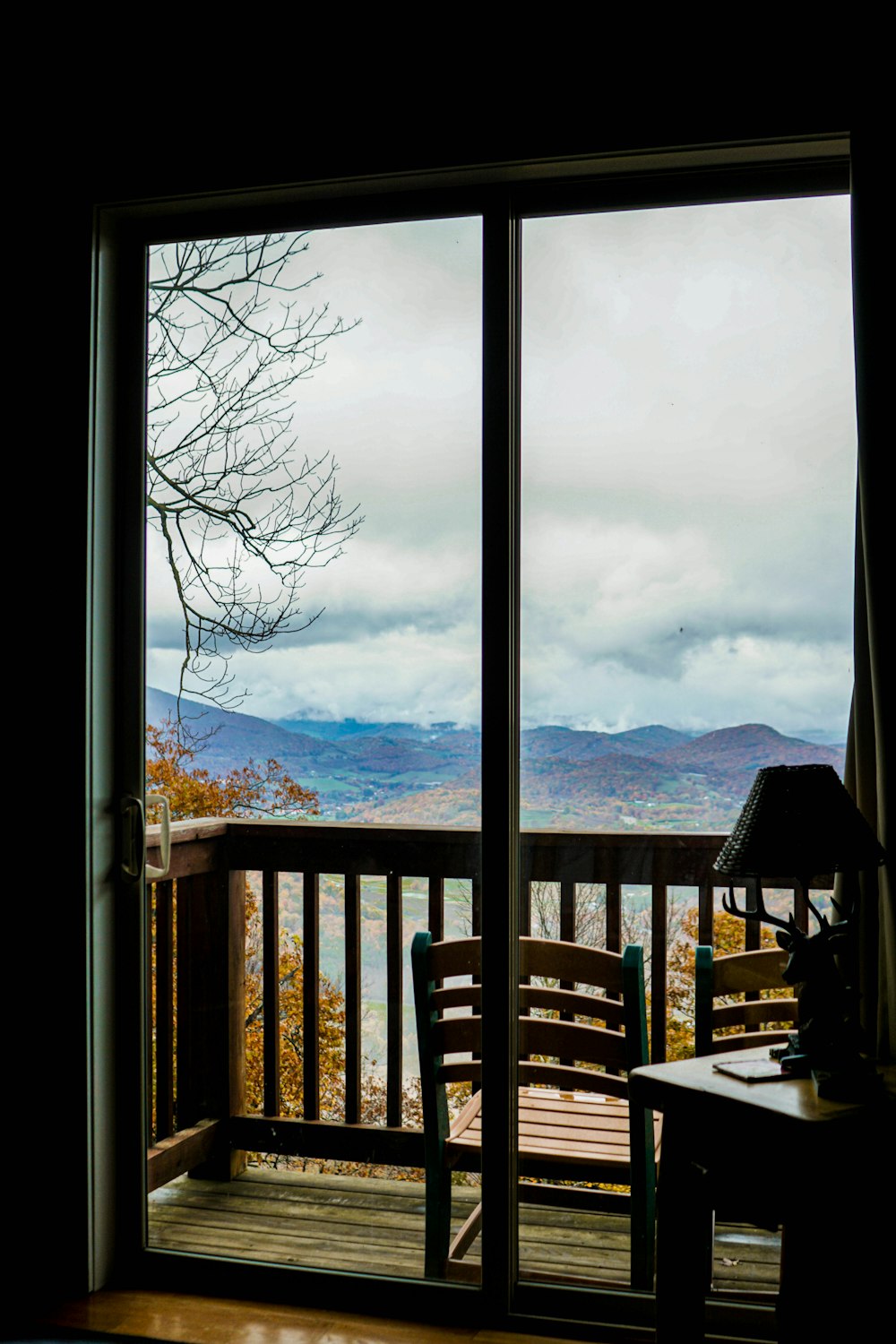 a balcony with a view of the mountains