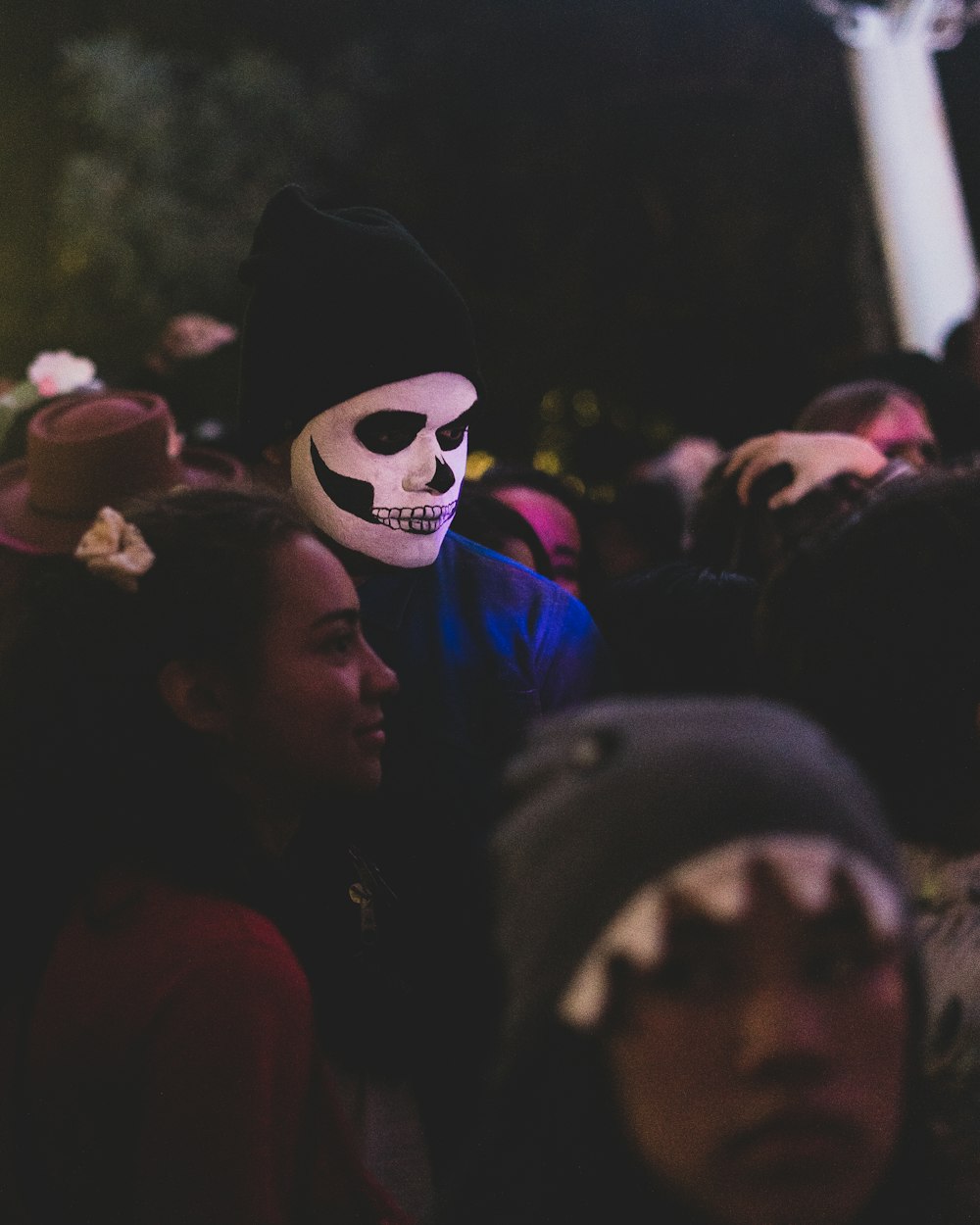a group of people with a skull mask on