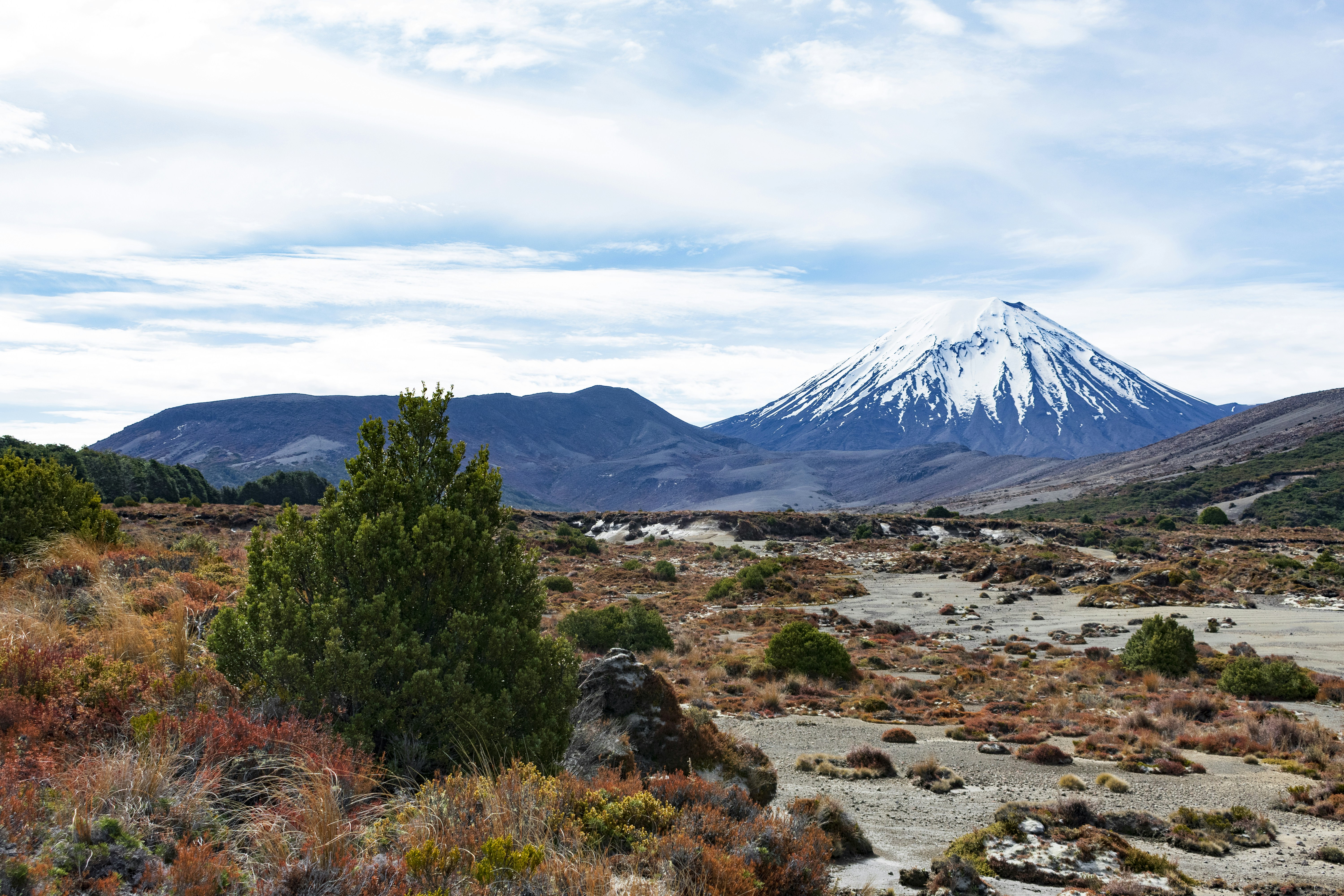 a mountain with a snow capped peak in the distance