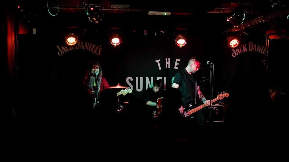 a group of people on stage playing instruments